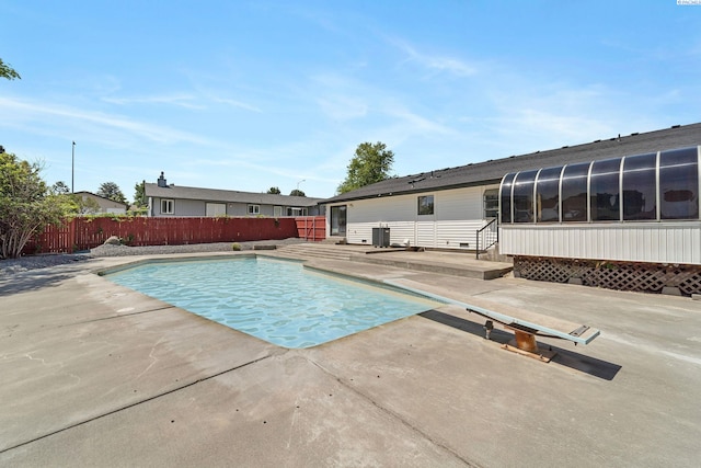 1819 Newport St, Kennewick, WA 99337 - view of swimming pool with a patio, a fenced backyard, a diving board, and central AC