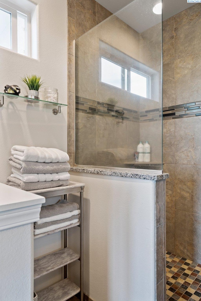 bathroom with tiled shower