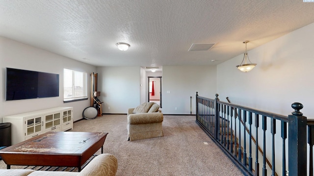 1025 SW Corral Ct, Pullman, WA 99163 - carpeted living area with a textured ceiling