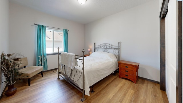 1025 SW Corral Ct, Pullman, WA 99163 - bedroom with light wood-style flooring and baseboards
