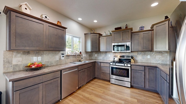 1025 SW Corral Ct, Pullman, WA 99163 - kitchen featuring stainless steel appliances, light wood-style flooring, recessed lighting, and decorative backsplash