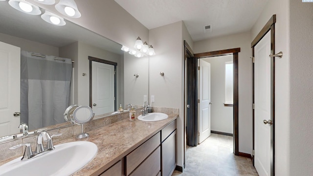 1025 SW Corral Ct, Pullman, WA 99163 - bathroom featuring double vanity, a shower with shower curtain, and tile patterned flooring