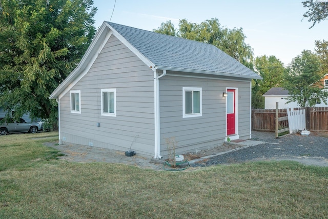 view of property exterior with a lawn