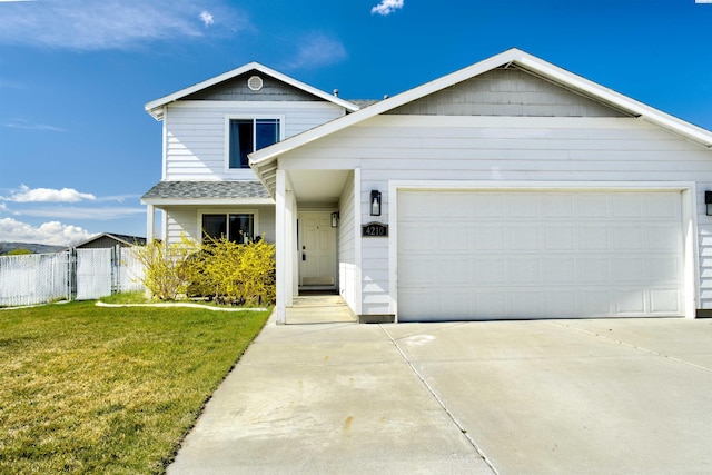 4210 Cornish Ln, Pasco, WA 99301 - traditional home featuring driveway, an attached garage, a front yard, and fence