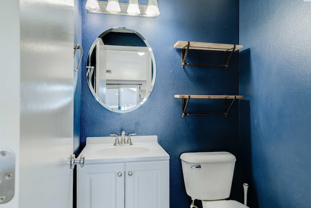 4210 Cornish Ln, Pasco, WA 99301 - half bath featuring vanity, toilet, and a textured wall
