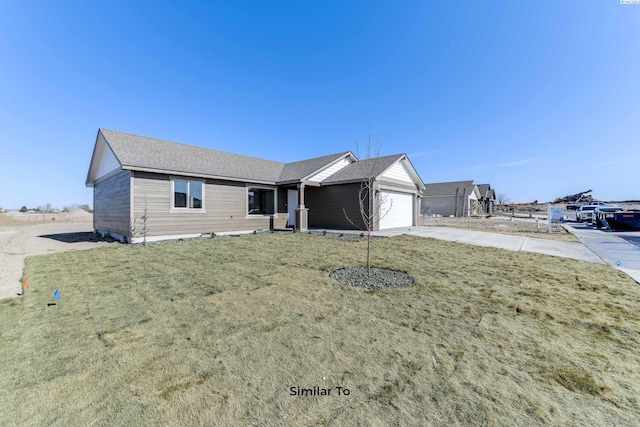 1610 Diamond Ave, Grandview, WA 98930 - ranch-style home featuring driveway, an attached garage, and a front lawn