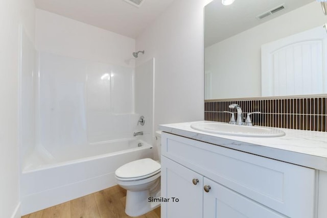 1610 Diamond Ave, Grandview, WA 98930 - bathroom featuring vanity, shower / bathtub combination, and wood finished floors