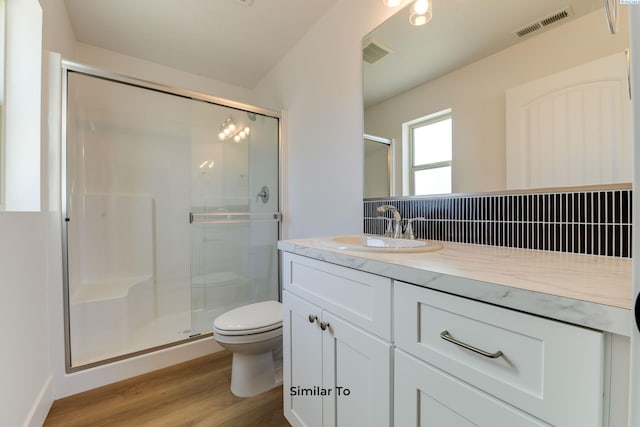1610 Diamond Ave, Grandview, WA 98930 - bathroom featuring wood finished floors, vanity, and a shower stall