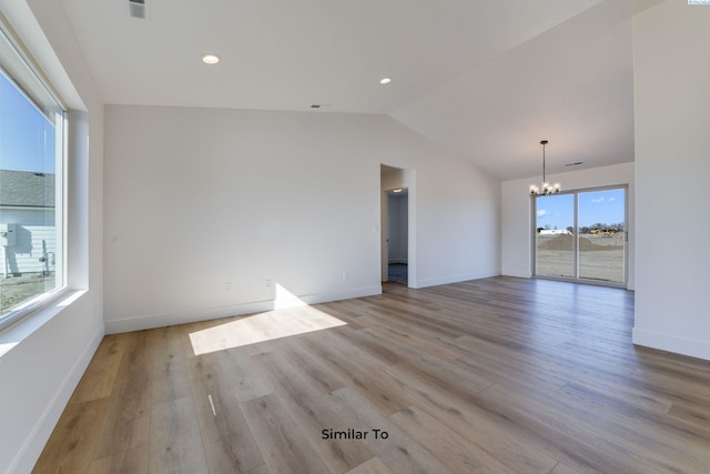 1610 Diamond Ave, Grandview, WA 98930 - spare room with a chandelier, lofted ceiling, light wood-style floors, and recessed lighting