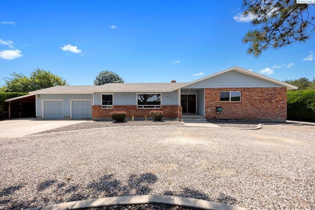 10012 Maple Dr, Pasco, WA 99301 - single story home featuring brick siding, a garage, a carport, and driveway