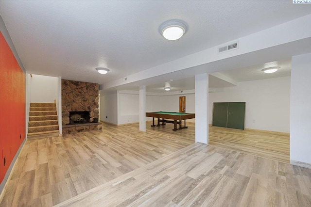 10012 Maple Dr, Pasco, WA 99301 - finished below grade area featuring light wood finished floors, billiards, a fireplace, and stairway