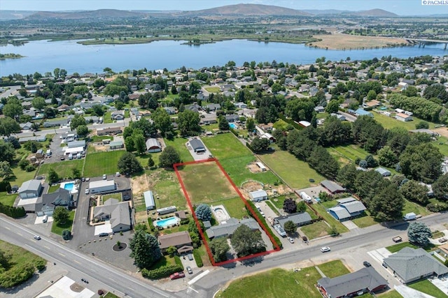 10012 Maple Dr, Pasco, WA 99301 - aerial view of property and surrounding area with a water and mountain view and property parcel outlined