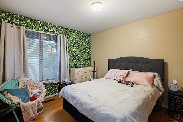 bedroom featuring hardwood / wood-style flooring