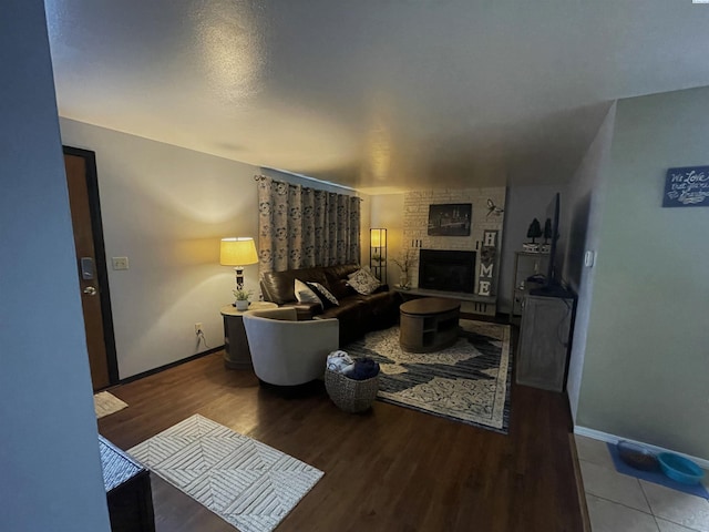 976 Campbell Dr, Prosser, WA 99350 - living area featuring baseboards, a fireplace, and wood finished floors