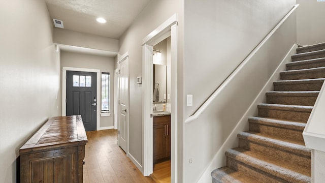 2955 S Kellogg St, Kennewick, WA 99338 - entryway with stairs, light wood-style floors, recessed lighting, and baseboards