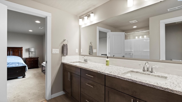2955 S Kellogg St, Kennewick, WA 99338 - ensuite bathroom featuring double vanity, an enclosed shower, baseboards, and recessed lighting