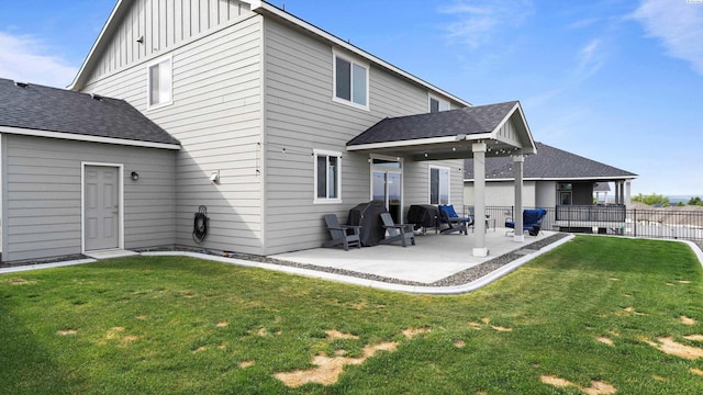 2955 S Kellogg St, Kennewick, WA 99338 - back of house with a patio area, board and batten siding, and a shingled roof