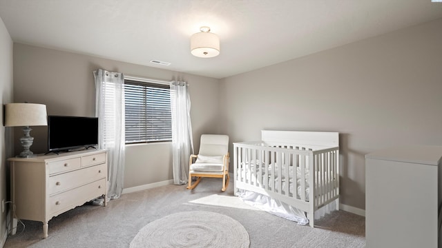2955 S Kellogg St, Kennewick, WA 99338 - bedroom with light colored carpet, baseboards, and a crib