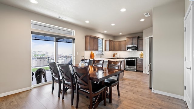 2955 S Kellogg St, Kennewick, WA 99338 - dining space with recessed lighting, light wood finished floors, and baseboards