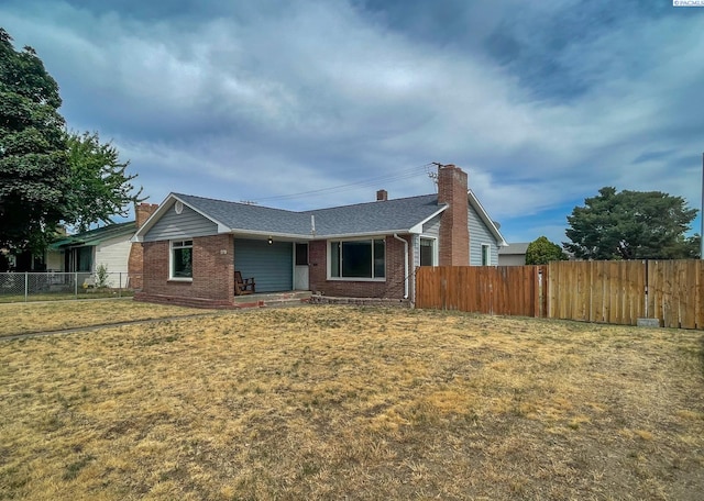 703 W Octave St, Pasco, WA 99301 - ranch-style house featuring brick siding, a chimney, and roof with shingles