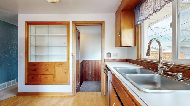 703 W Octave St, Pasco, WA 99301 - kitchen with light wood-style flooring, dishwasher, light countertops, and brown cabinetry