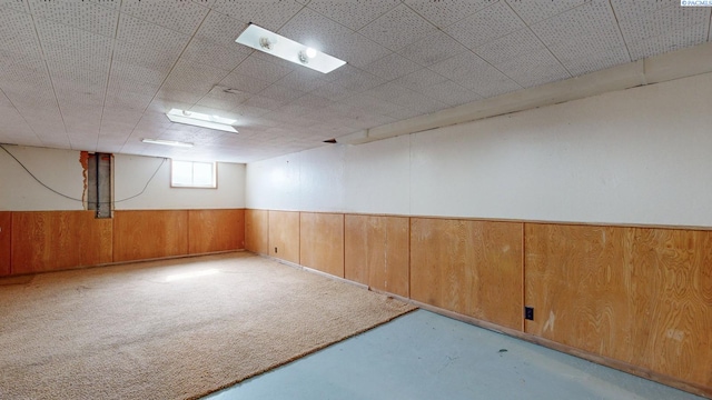 703 W Octave St, Pasco, WA 99301 - spare room with concrete floors, wooden walls, and wainscoting