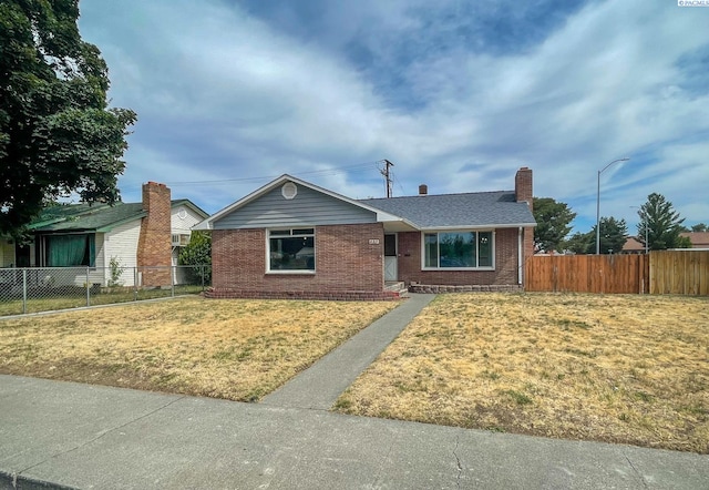 703 W Octave St, Pasco, WA 99301 - ranch-style house with brick siding and a chimney