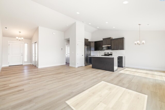 6563 W 30th Pl, Kennewick, WA 99338 - kitchen featuring stainless steel appliances, an inviting chandelier, open floor plan, and light countertops