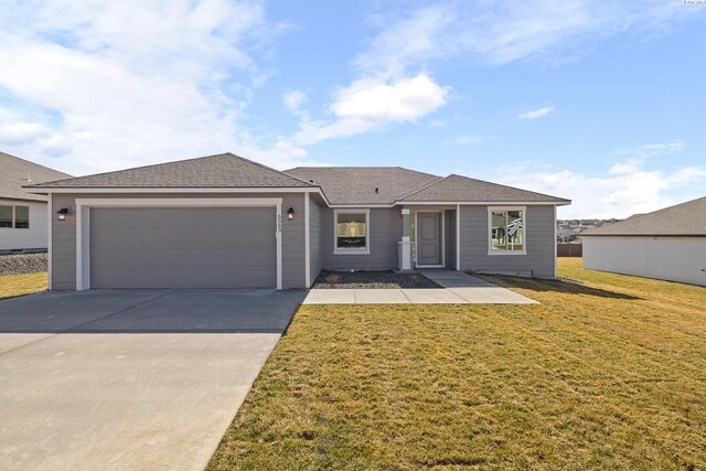 6563 W 30th Pl, Kennewick, WA 99338 - ranch-style house with an attached garage, concrete driveway, a front lawn, and a shingled roof