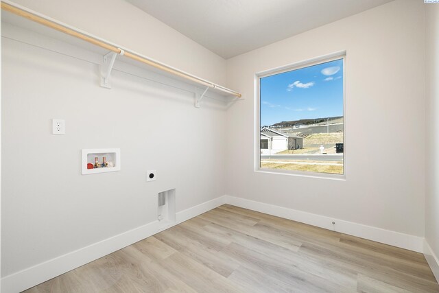 6563 W 30th Pl, Kennewick, WA 99338 - washroom with washer hookup, wood finished floors, baseboards, hookup for an electric dryer, and laundry area