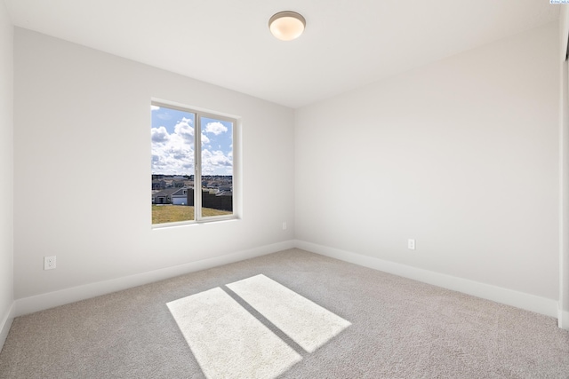 6563 W 30th Pl, Kennewick, WA 99338 - spare room featuring carpet flooring and baseboards