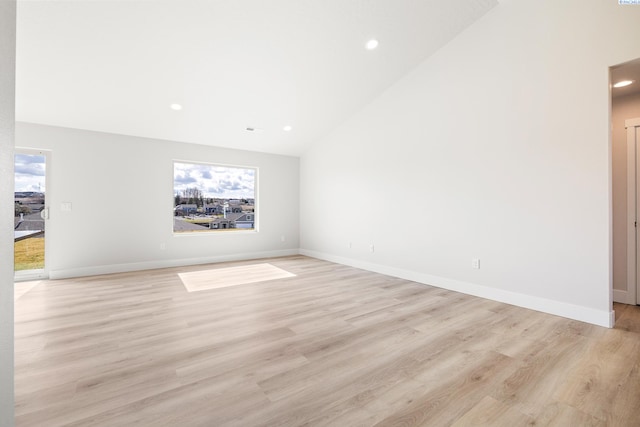 6563 W 30th Pl, Kennewick, WA 99338 - unfurnished room featuring recessed lighting, baseboards, light wood-type flooring, and lofted ceiling
