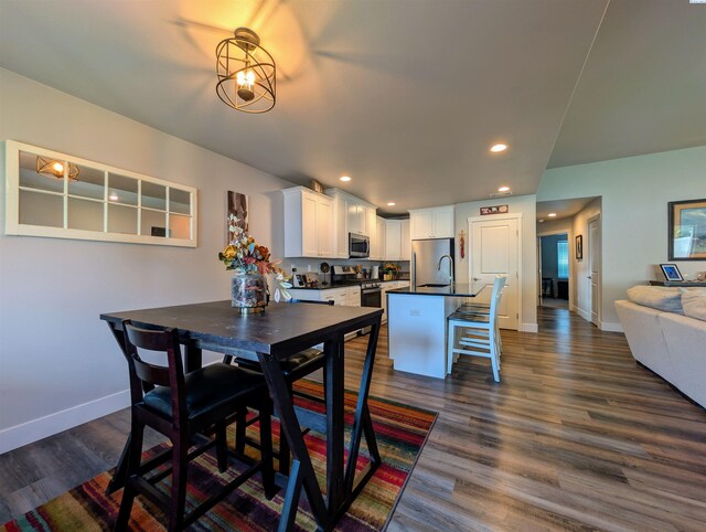 1519 W 33rd Pl, Kennewick, WA 99337 - dining room featuring baseboards, dark wood-type flooring, and recessed lighting
