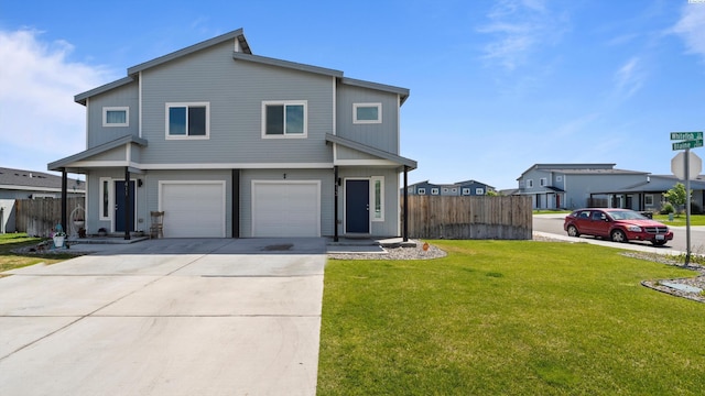413 Whitefish Ln, Pasco, WA 99301 - view of front facade featuring a garage and concrete driveway
