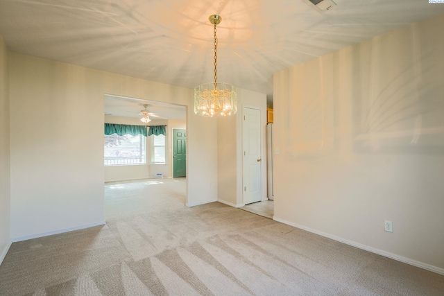 927 N Owen Ave, Pasco, WA 99301 - empty room with light colored carpet, a chandelier, and baseboards