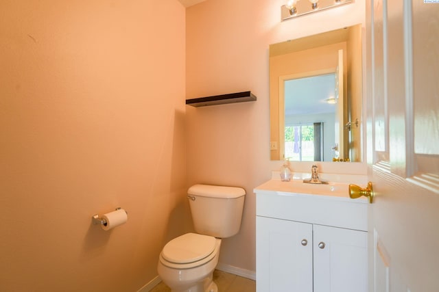 927 N Owen Ave, Pasco, WA 99301 - bathroom with toilet, vanity, and baseboards