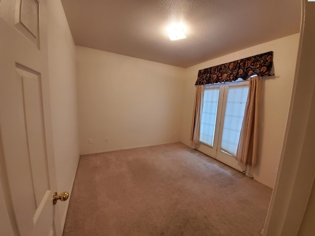 5416 Mariner Ln, Pasco, WA 99301 - spare room featuring light colored carpet and a textured ceiling