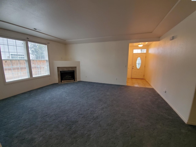 5416 Mariner Ln, Pasco, WA 99301 - unfurnished living room featuring plenty of natural light, carpet, and a fireplace