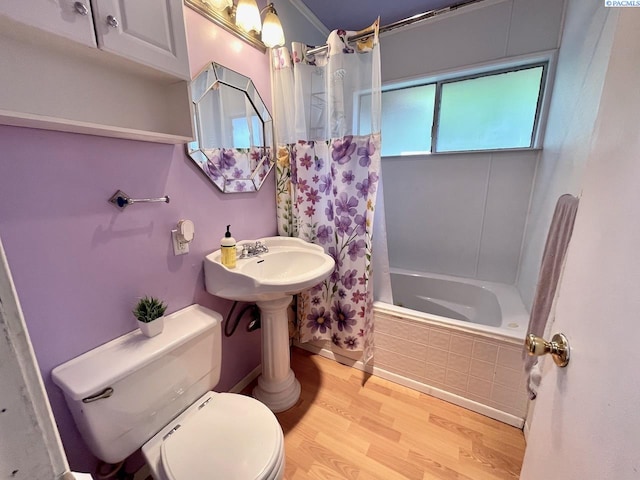 2402 Dover St, Richland, WA 99352 - bathroom featuring wood finished floors, tiled shower / bath, and toilet