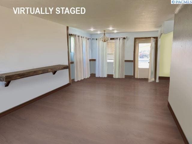 2402 Dover St, Richland, WA 99352 - unfurnished room with baseboards and wood finished floors