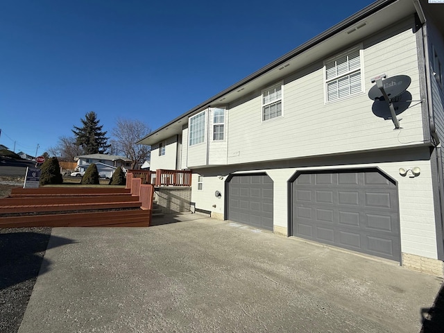 view of side of property with a garage