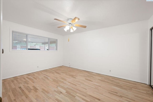 unfurnished room featuring ceiling fan and light wood-type flooring