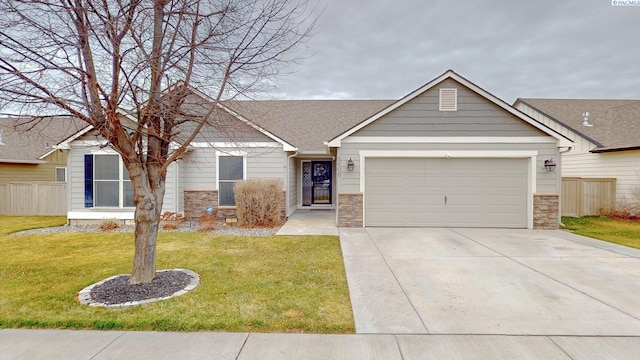 view of front facade with a garage and a front lawn