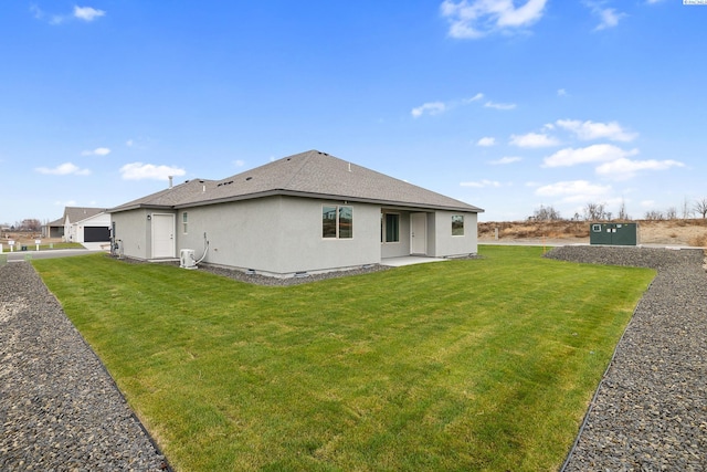 10402 Kokanee Dr, Pasco, WA 99301 - back of property featuring stucco siding, a lawn, and roof with shingles