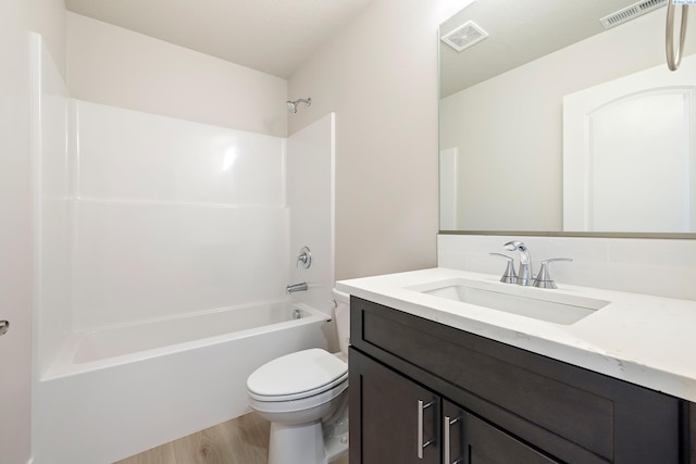 10402 Kokanee Dr, Pasco, WA 99301 - full bath featuring vanity, wood finished floors, and washtub / shower combination