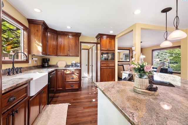 4834 W Robin Ct, West Richland, WA 99353 - kitchen featuring black appliances, light stone counters, dark wood-style floors, recessed lighting, and pendant lighting