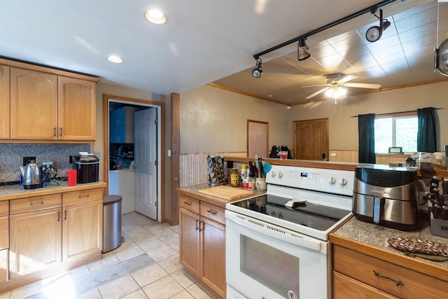 kitchen featuring white range with electric cooktop, tasteful backsplash, rail lighting, light tile patterned flooring, and ceiling fan