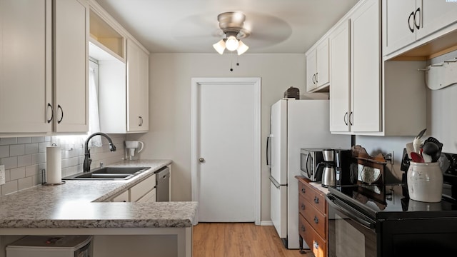 kitchen with ceiling fan, black / electric stove, backsplash, a sink, and light wood-style flooring