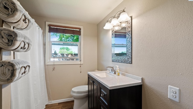 bathroom featuring vanity, toilet, baseboards, curtained shower, and wood finished floors