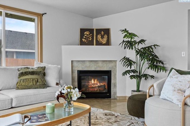 living room with a tiled fireplace